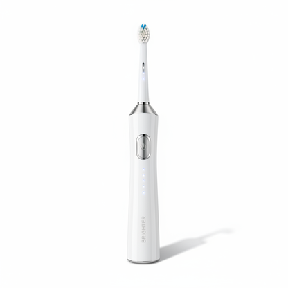 Glossy white electric toothbrush with silver accents